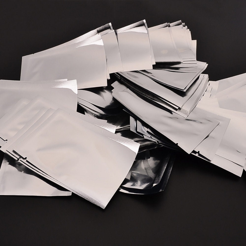 100pcs/pack Silver Vacuum Sealer Aluminum Foil Mylar Bags Zip Lock Storage Pouch 100pcs/pack Silver Vacuum Sealer Aluminum Foil Mylar Bags Zip Lock Storage Pouch