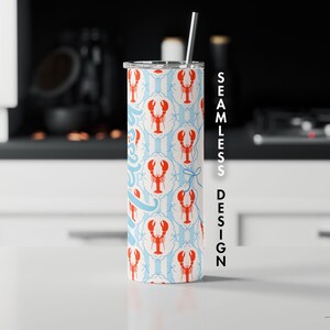 May include: A stainless steel tumbler with a seamless design featuring red lobsters on a light blue and white striped background. The tumbler includes a silver straw and a silver lid. The design is repeated around the entire tumbler.