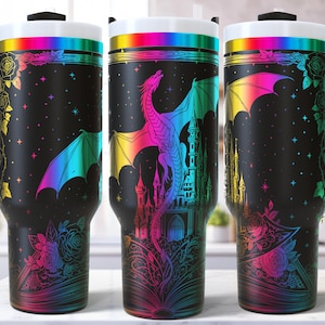 May include: Black travel mugs with a fantasy theme. Each mug features a colorful dragon, castle, and floral design against a starry background. The mugs have a black handle, a white rim, and a rainbow-colored band.