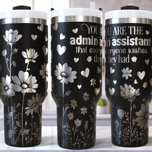 May include: Three black stainless steel travel mugs with a floral design and the text "You are the admin assistant that everyone wishes they had".