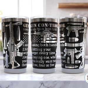 May include: Three stainless steel tumblers with black backgrounds and silver gun designs. The text on the tumblers reads "GUN CONTROL" and includes definitions and instructions. The tumblers have a silver rim and a gray base.