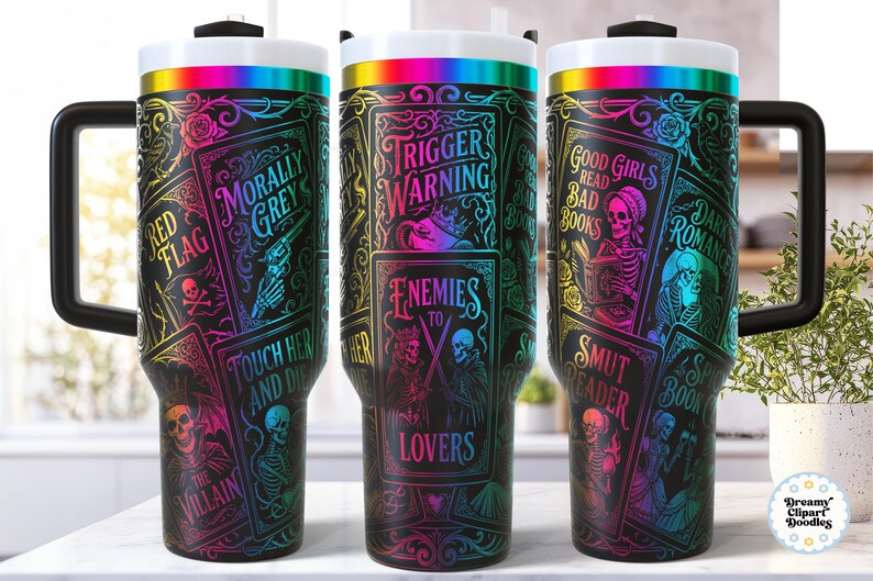 May include: Three black travel mugs with a wraparound design featuring gothic illustrations and text. The text includes "Trigger Warning," "Enemies to Lovers," and "Good Girls Read Bad Books." The mugs have a black handle and a white lid with a rainbow band.