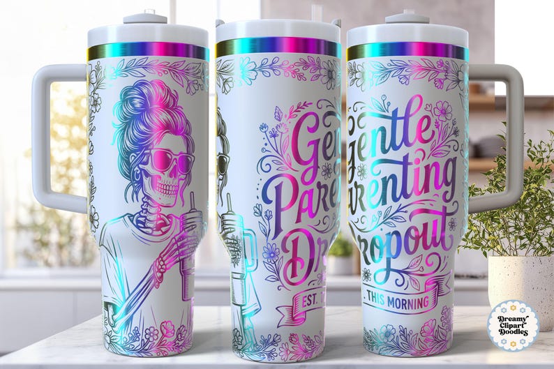 May include: White tumbler with a wraparound design featuring a skeleton with sunglasses and the text "Gentle Parenting Dropout." The design includes floral accents and a rainbow color scheme. The tumbler has a white handle and lid.