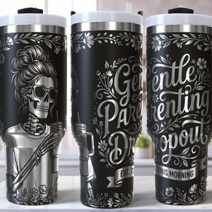 May include: Black travel mug with a white lid and handle. The mug features a skeleton wearing sunglasses and holding a drink. The text "Gentle Parenting Dropout" is displayed in silver script. A floral design decorates the mug.