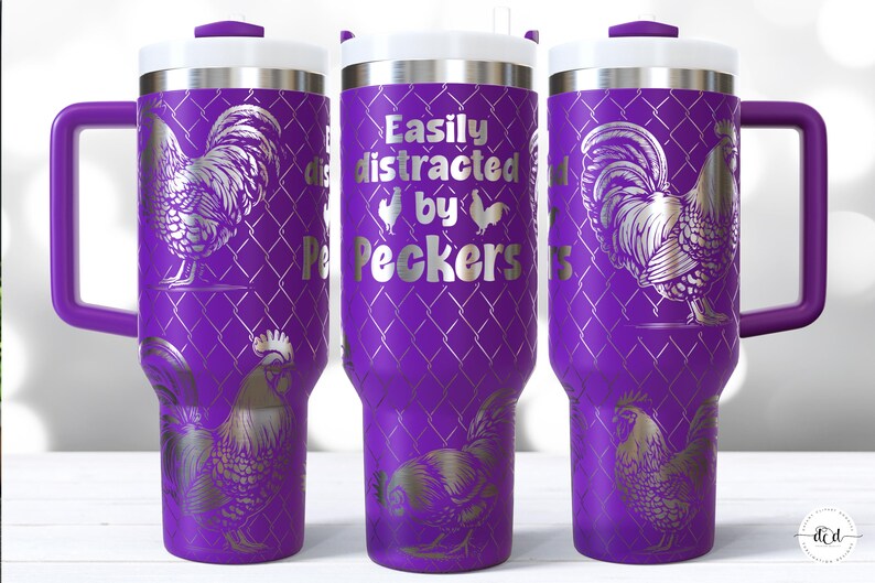 May include: A purple travel mug with a white lid and handle. The mug features a silver rooster design and the text "Easily distracted by Peckers". The design is repeated around the mug.
