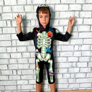 KiLiKuaLa Glow In The Dark Skeleton Halloween Costume For Kids | Includes Costume, Mask & Gloves | Boys & Girls - View #6