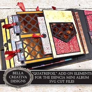 May include: A handmade mini album with decorative pages. The album features intricate cut-out designs, patterned papers in gold, red, and blue, and is tied with red ribbons. The album includes the text "QUATREFOIL" ADD ON ELEMENTS FOR THE ESENCIA MINI ALBUM SVG CUT FILES.