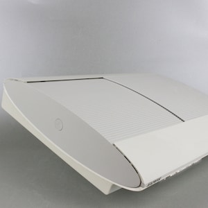 May include: A white PlayStation 3 console with a sliding disc tray.