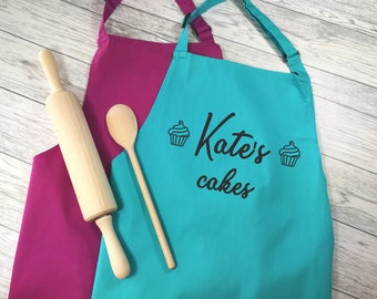 Personalised adult Cakes apron in raspberry or duck egg blue with choice of coloured detail