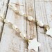 Megan Smith reviewed Gold drop freshwater pearl chain earrings with shell star charm, gold white pearl star dangle earrings