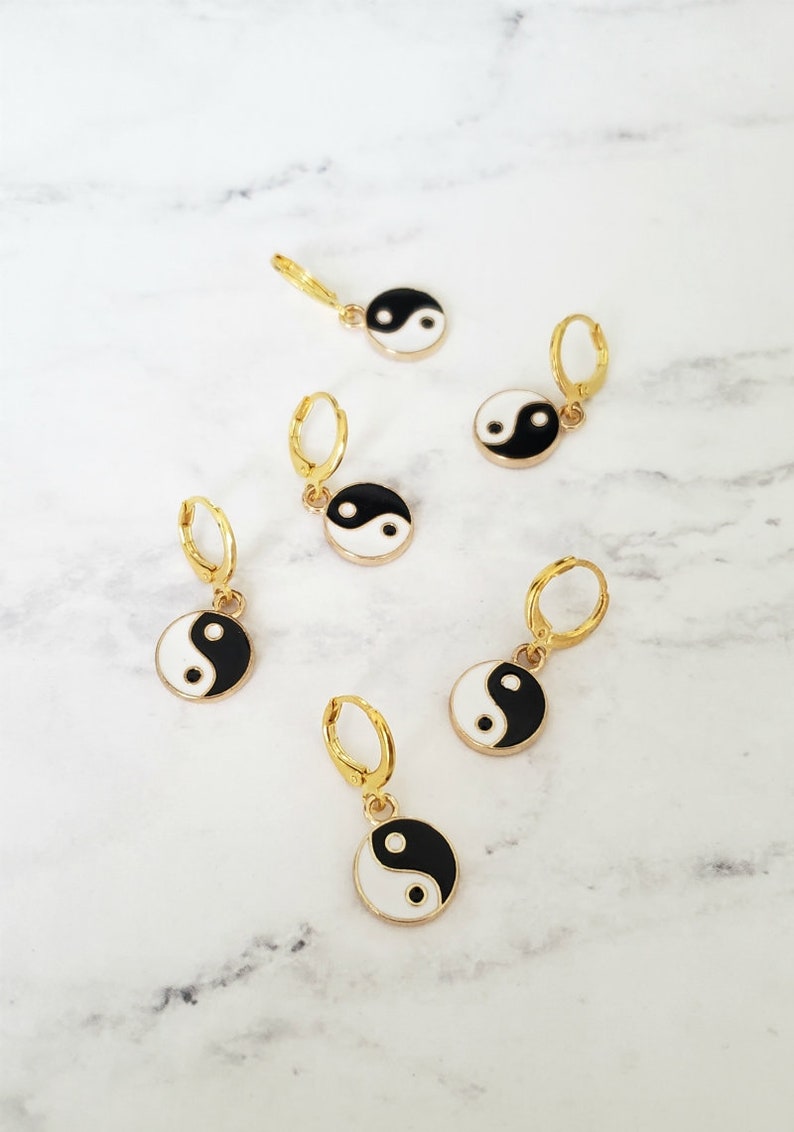 Gold huggies gold earrings yin yang earrings charm huggies image 0