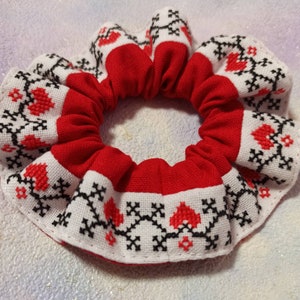 Red scrunchie with hand-embroidered Ukrainian ornament