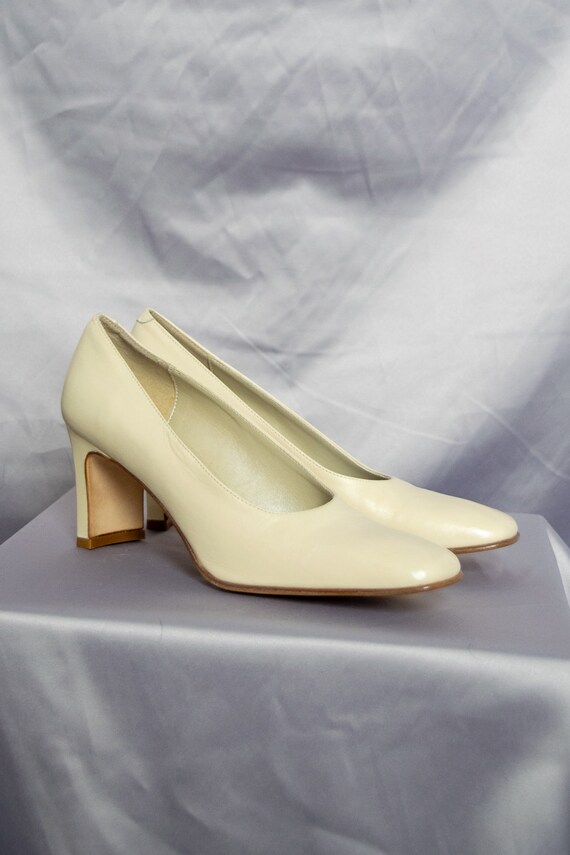 cream leather pumps