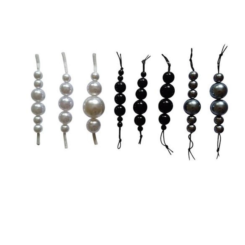 May include: A collection of beaded strands in different colours and sizes. The strands feature white, black, and grey beads, varying from small to large, with a glossy finish. Each strand is strung on a thin cord, creating a decorative element.