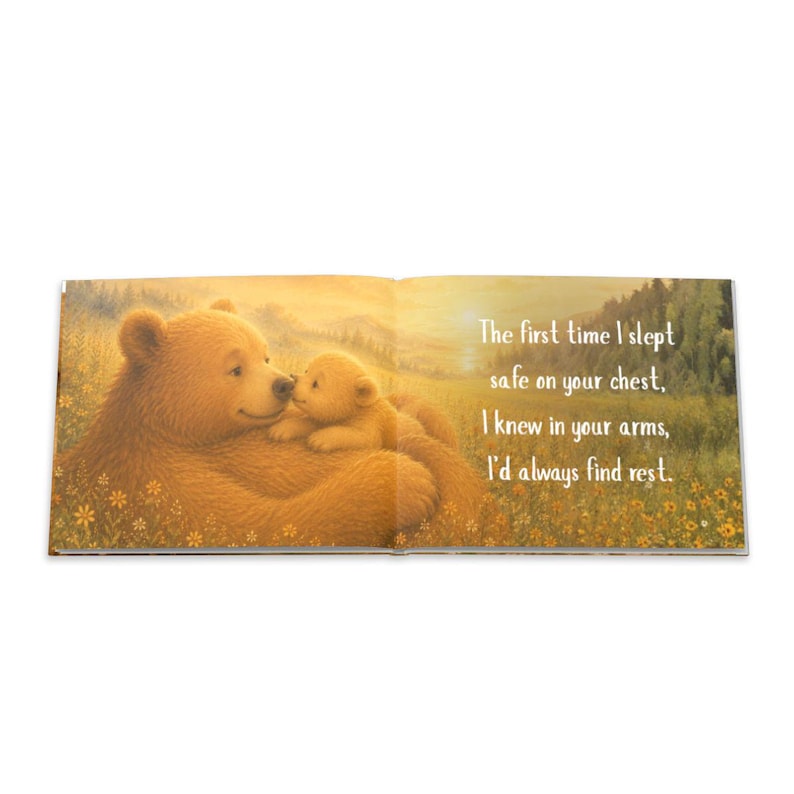 May include: An open book with a heartwarming illustration of a mother bear and cub nestled together in a field of flowers. The text reads, "The first time I slept safe on your chest, I knew in your arms, I'd always find rest."
