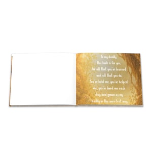May include: An open book with a white left page and a right page with text and a gold and brown nature-themed illustration. The text reads, "To my daddy, this book is for you, for all that you've learned and all that you do."