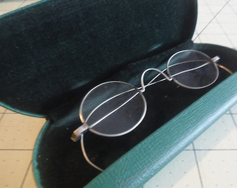 Wire rim glasses in case