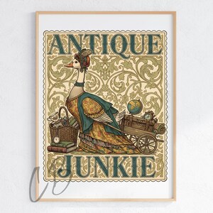 May include: A framed print featuring a whimsical illustration of a goose dressed in antique attire. The goose stands beside a cart filled with vintage items, with the words "ANTIQUE JUNKIE" displayed above and below the goose in a decorative font. The background has a floral pattern.