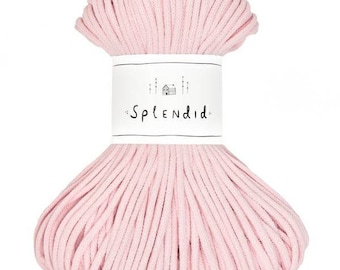 May include: A pink cotton cord, wound into a ball, with a white label that reads "Splendid" in black lettering.