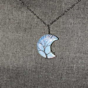 Crescent moon crystal pendants wire-wrapped with the tree of life