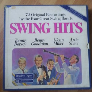 May include: A vintage "Swing Hits" record album box set. The cover features the title in large pink letters, with the names of the bands and musicians below. The album art depicts four men in suits playing instruments. The Reader's Digest logo is visible.