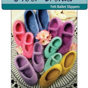 May include: A close-up of a variety of felt ballet slippers in different colors, including pink, purple, blue, green, and yellow. The slippers are arranged on a white crocheted surface. "Fiber Trends" and "Felt Ballet Slippers" are printed on the top of the image.