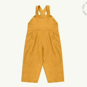 May include: Mustard yellow linen overalls with a criss-cross strap detail in the back.