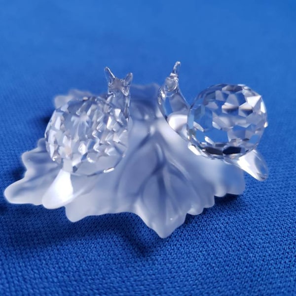 Swarovski crystal baby snail in leaf w/ original box and COA
