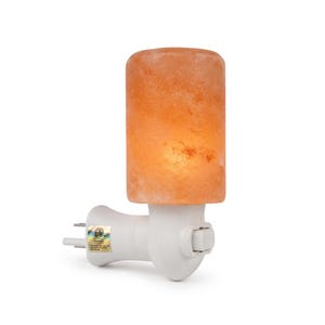 May include: A Himalayan salt night light featuring an orange cylindrical salt crystal shade. The night light plugs directly into a wall socket and has a white plastic base with an on/off switch. The salt crystal glows when the light is on.