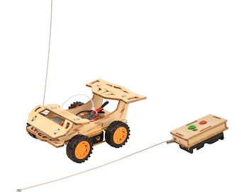 May include: A wooden toy race car with an orange and black design. The car has a remote control with two buttons. The car is connected to the remote control by a wire.
