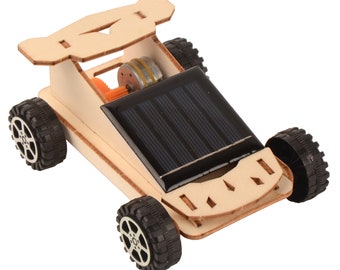 May include: A wooden toy car with black wheels and a solar panel on top. The car is powered by the sun and is a great educational toy for kids.