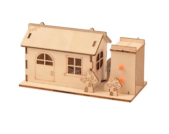 May include: A wooden model kit of a house with a mushroom-shaped roof and a small, separate building. The model is made of natural wood and has a rustic, charming look.