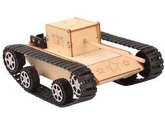 May include: A wooden toy tank with black tracks and a wooden cannon. The tank has a number "121" on the side and stars on the back.