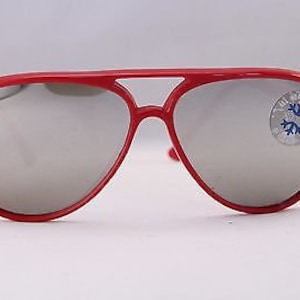 May include: Red aviator sunglasses with mirrored lenses. The sunglasses have a blue sticker on the right lens.