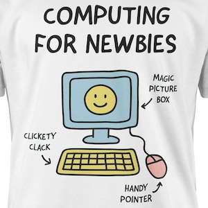 May include: White t-shirt featuring a cartoon computer graphic with the text "COMPUTING FOR NEWBIES". The illustration includes a keyboard, mouse, and a computer screen with a smiley face.