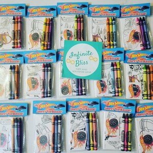 May include: Ten small plastic bags filled with coloring pages and crayons. Each bag has a Hot Wheels logo and the text "Joseph's 4th Birthday". The bags are arranged in two rows of five.