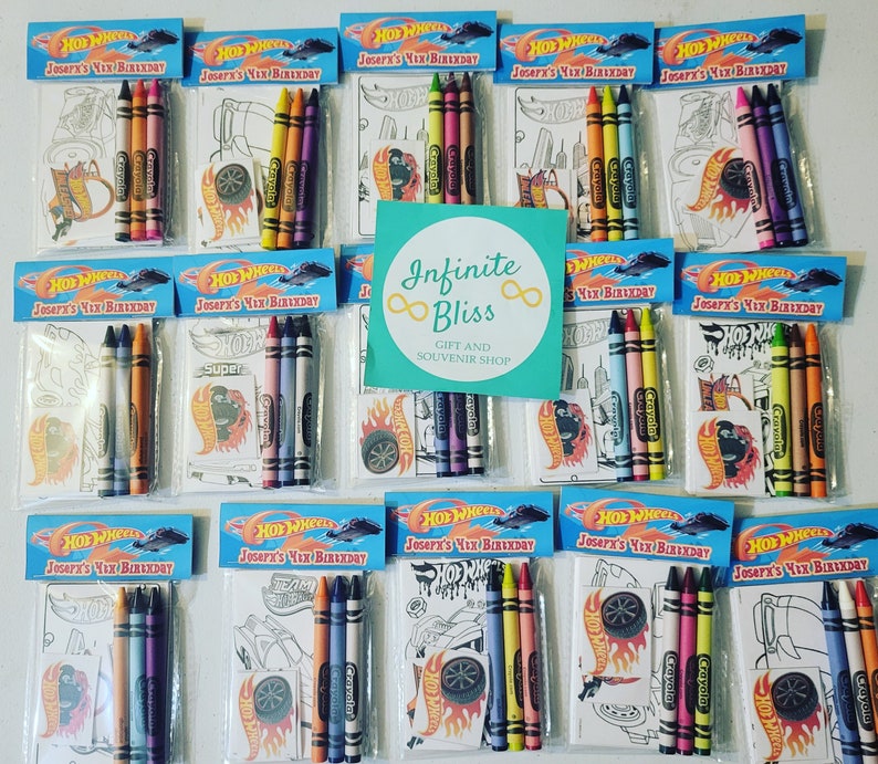 May include: Ten small plastic bags filled with coloring pages and crayons. Each bag has a Hot Wheels logo and the text "Joseph's 4th Birthday". The bags are arranged in two rows of five.