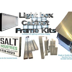 May include: A collection of light box cabinet frame kits featuring metallic aluminum extrusions, internal LED lighting components, and power supplies. The display includes a finished sign example with the text SALT INDUSTRIES 618-538-6223.