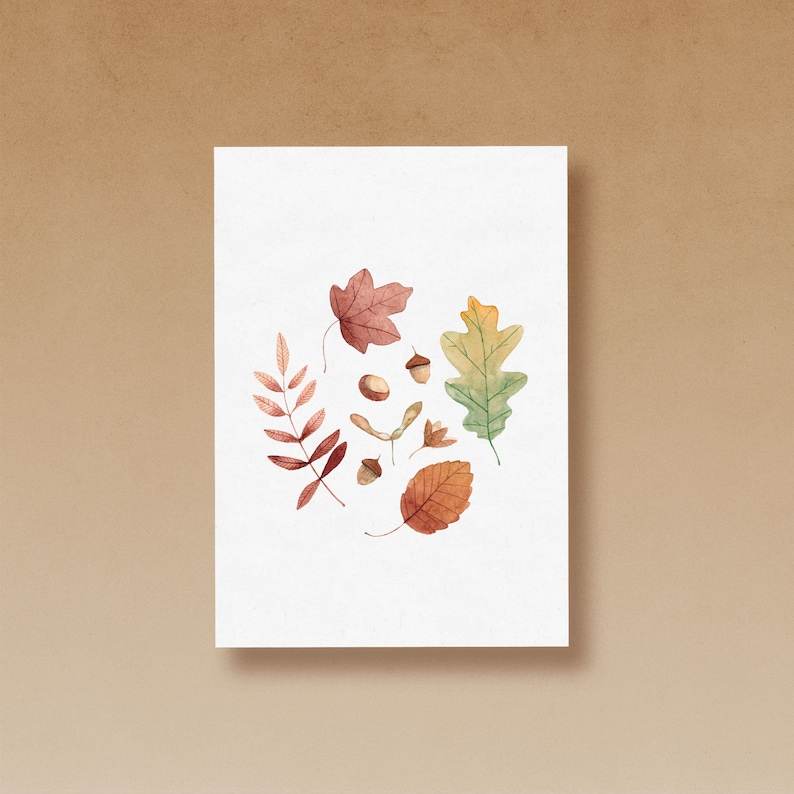 Puede incluir: Una ilustraci&oacute;n de acuarela de hojas de oto&ntilde;o y bellotas. Las hojas son de tonos rojos, naranjas, amarillos y verdes. Las bellotas son marrones.