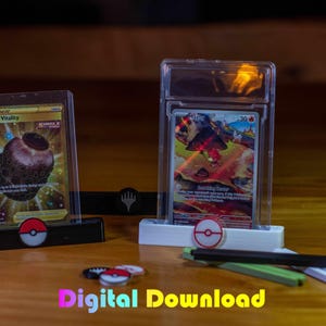 May include: Two trading card displays with cards inside, one with a gold card and the other with a card featuring a fiery creature. The displays are on a wooden surface, with a few small accessories and the text "Digital Download".