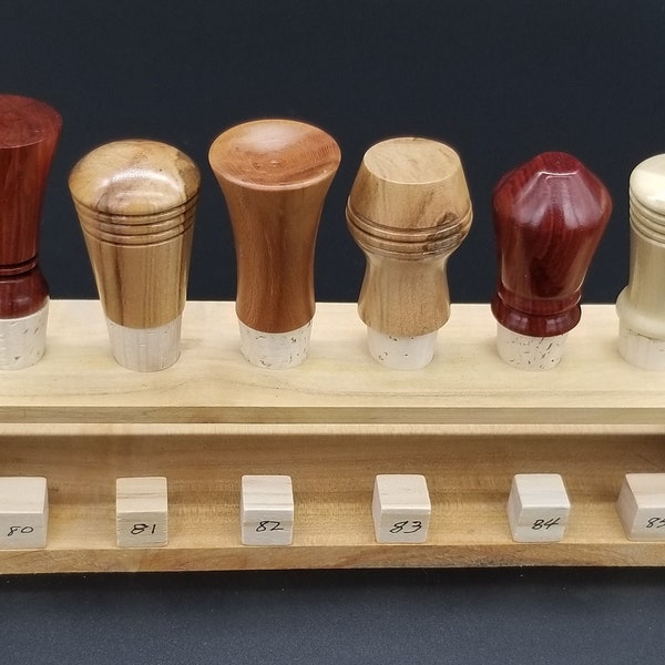 Beautiful lathe-turned domestic and exotic hardwood bottle stoppers, corked and ready to go! Great for gifting or for corking the left-overs