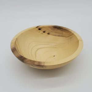 Beautiful magnolia bowl with interesting markings, sturdy and useful in the kitchen or on the sidebar for dry fruit, chips or nuts