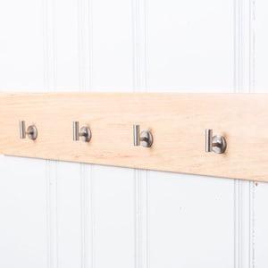 Flush wall- mounted coat rack