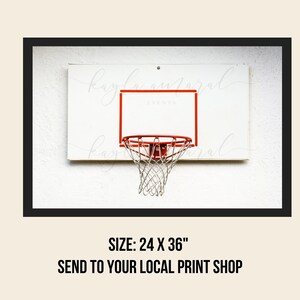 May include: A white basketball hoop with a red rim and a white net against a white wall. The hoop is 24 inches by 36 inches.