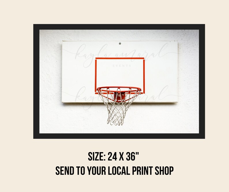 May include: A white basketball hoop with a red rim and a white net against a white wall. The hoop is 24 inches by 36 inches.