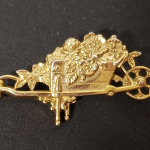 1928 Brand Gold Tone Wheelbarrow of Flowers Brooch