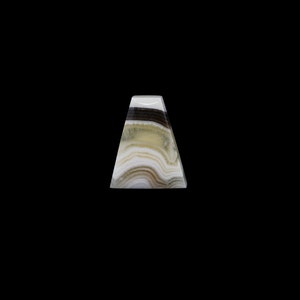 May include: A triangular shaped, white, green, and black onyx pyramid with a smooth, polished surface.