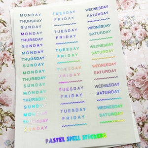 May include: A sheet of pastel colored stickers with the days of the week written on them. The stickers are iridescent and have a wavy border. The text "PASTEL SPELL STICKERS" is printed at the bottom of the sheet.