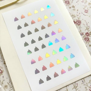 May include: A sheet of iridescent poop stickers in various colors, including blue, green, purple, orange, yellow, and brown.