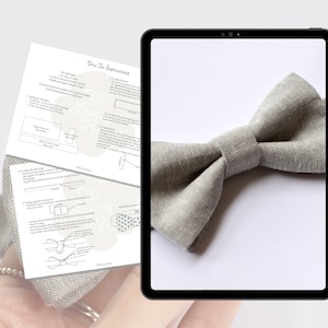 May include: Instructions for making a bow tie using grey linen fabric. The instructions include cutting the fabric, sewing the neck strap, and putting the bow tie together.